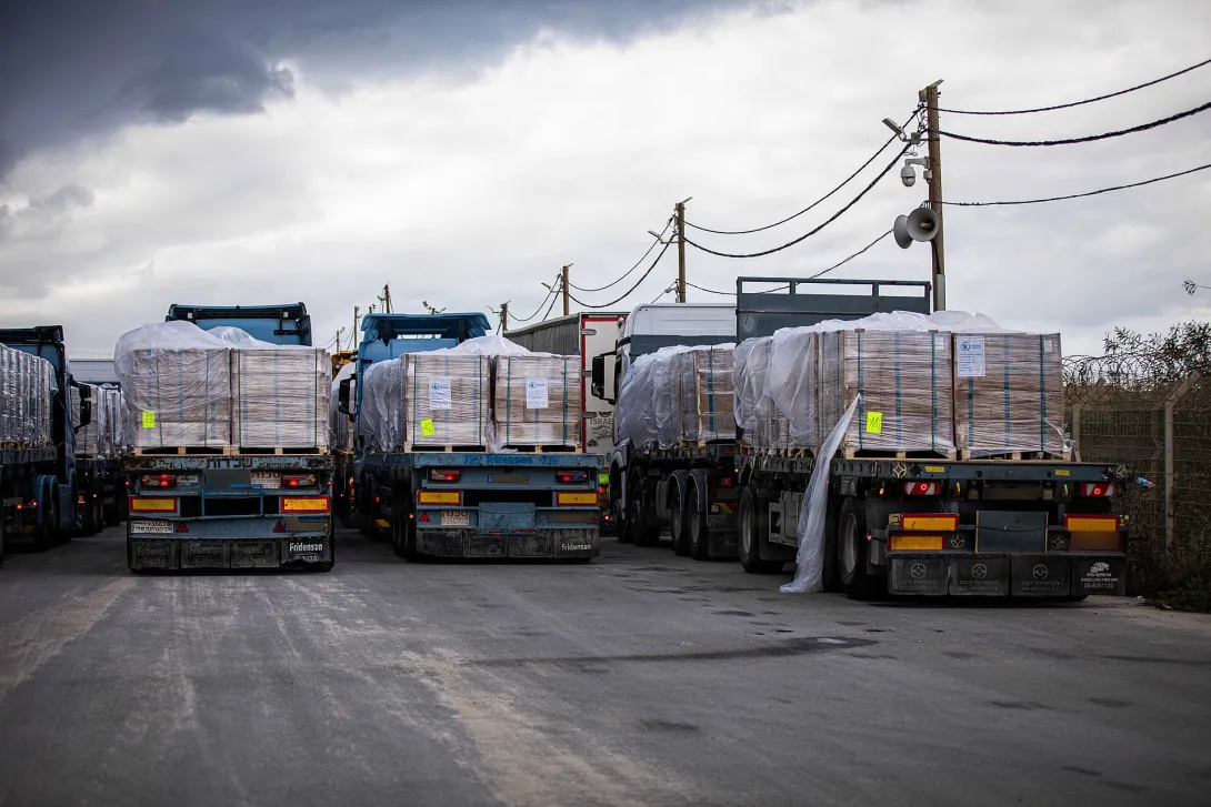Trucks carrying humanitarian aid wait at the Zikim crossing, November 2025